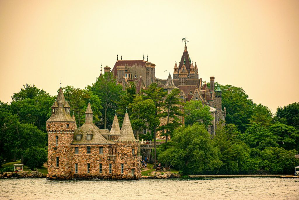 A castle on a small island in the middle of a lake