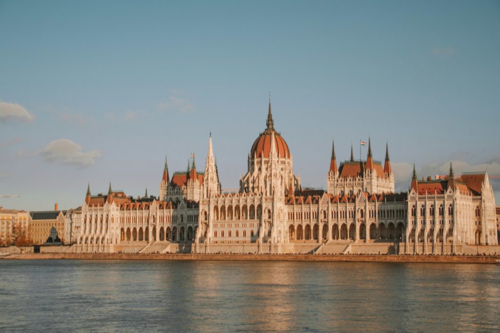 a large building sitting next to a body of water