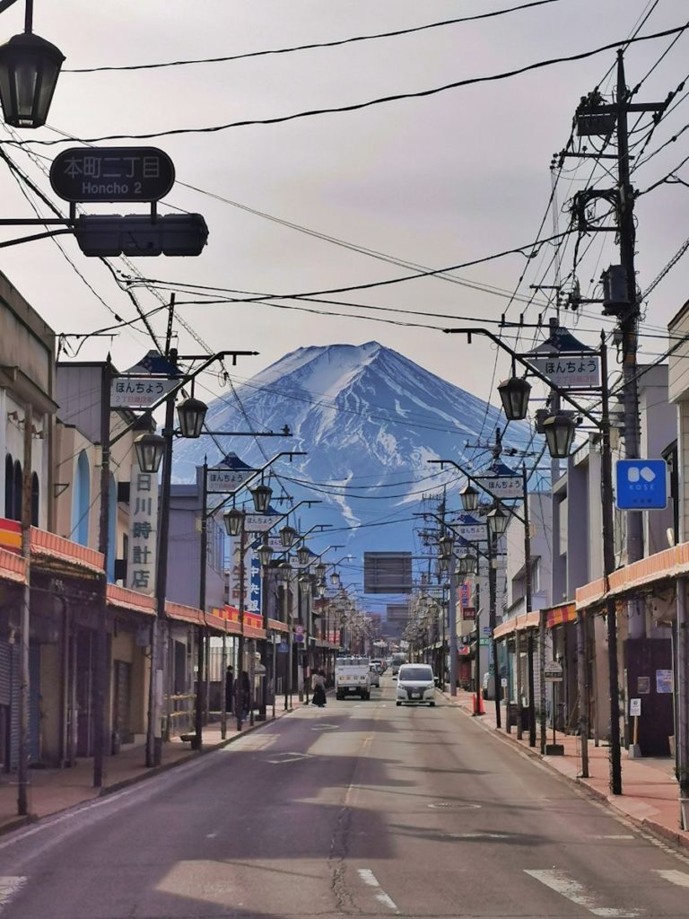 a street with a mountain in the background