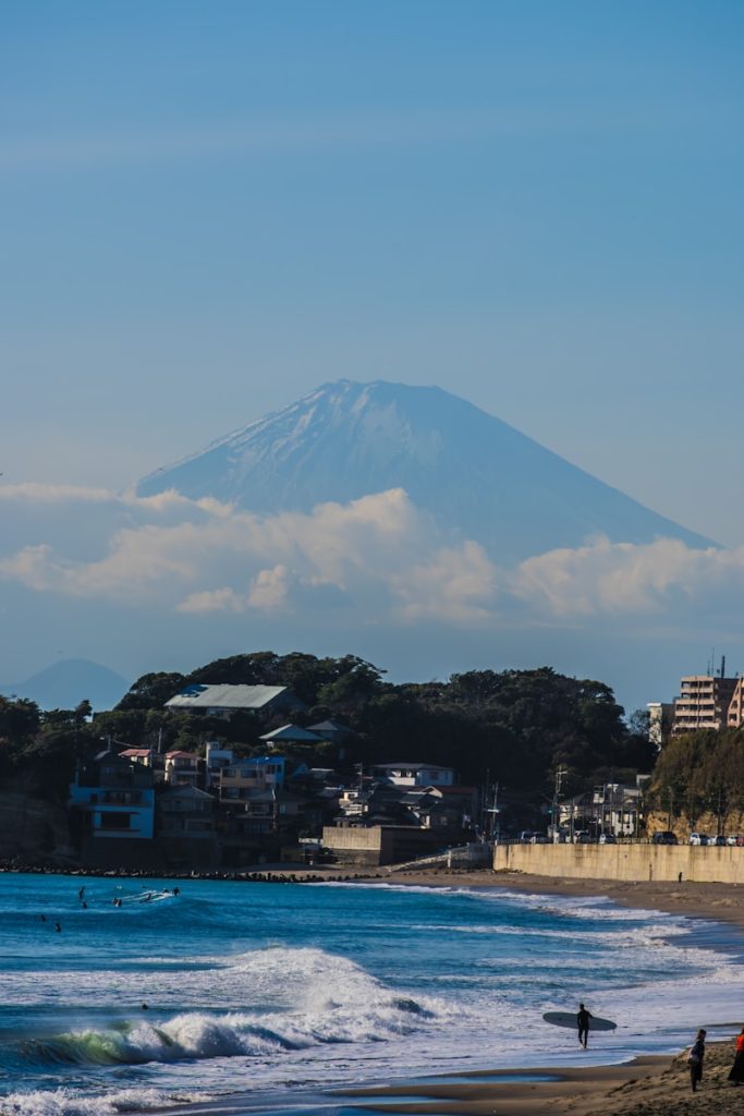 a view of a beach with a mountain in the background