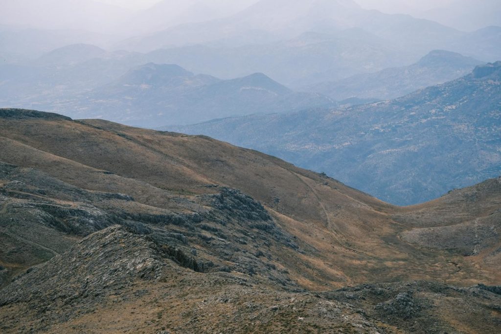 Calm mountain landscape with layered hills and serene atmosphere.