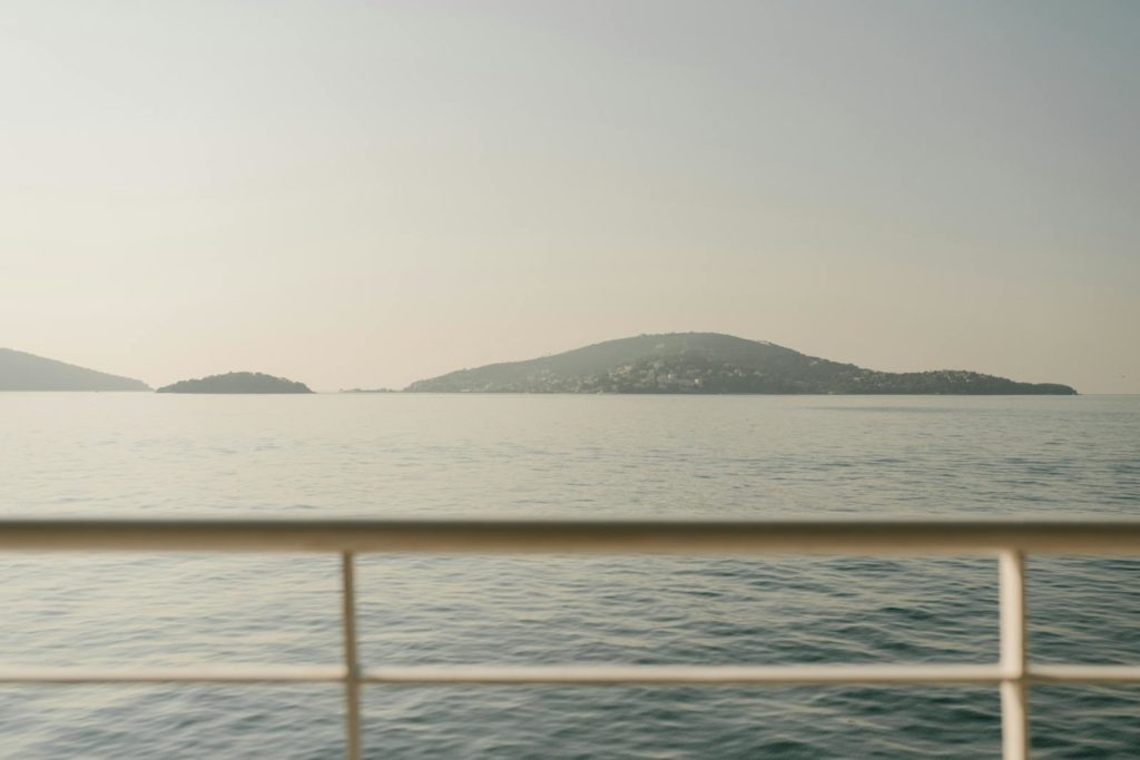 Serene seascape showing islands in Istanbul viewed from a boat, ideal for travel or tranquility themes.