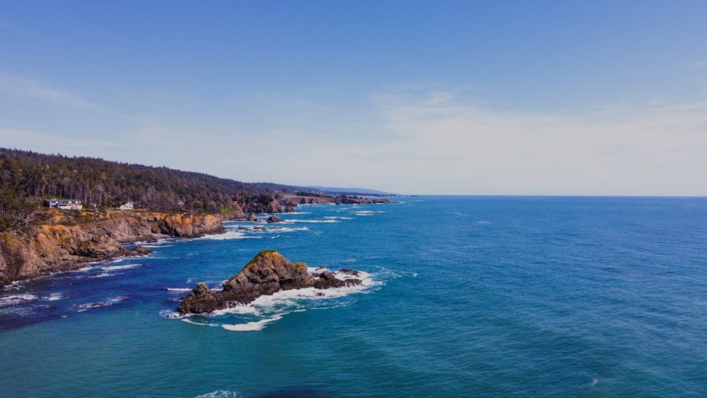 an aerial view of the ocean and coastline