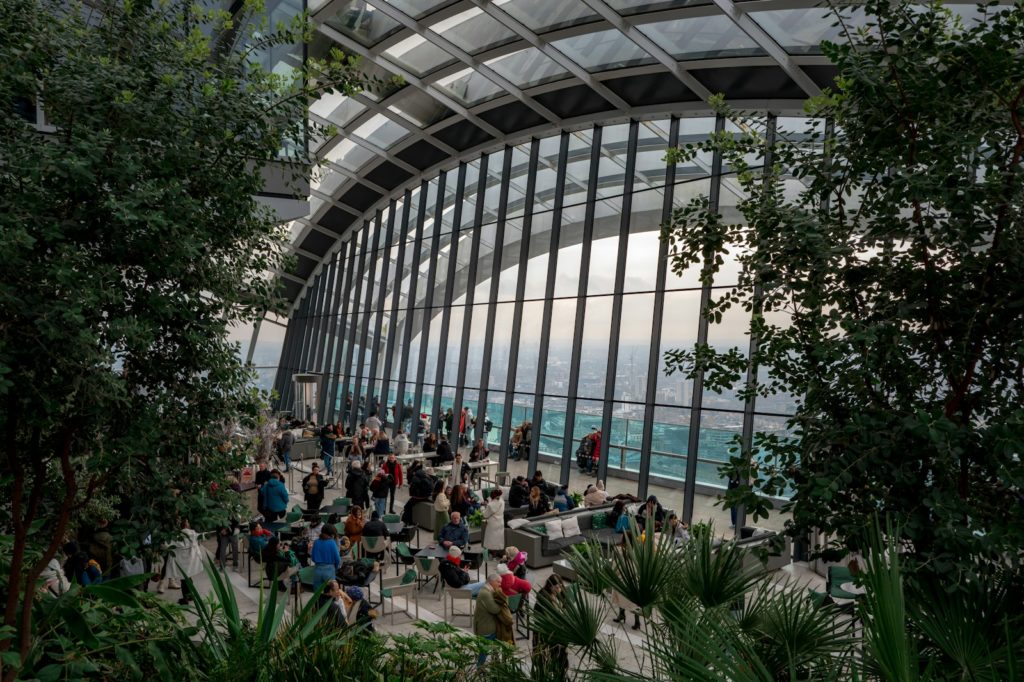 A group of people sitting in a large building