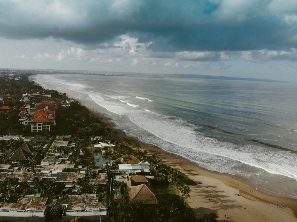 aerial view of city near sea during daytime