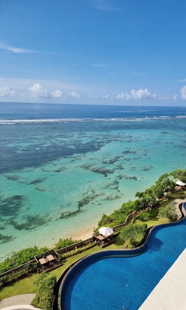 a view of the ocean from the top of a building