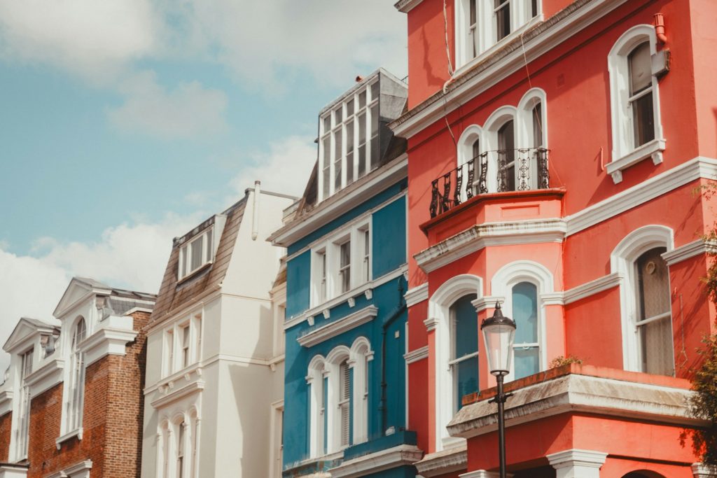 A row of multi - colored buildings on a city street